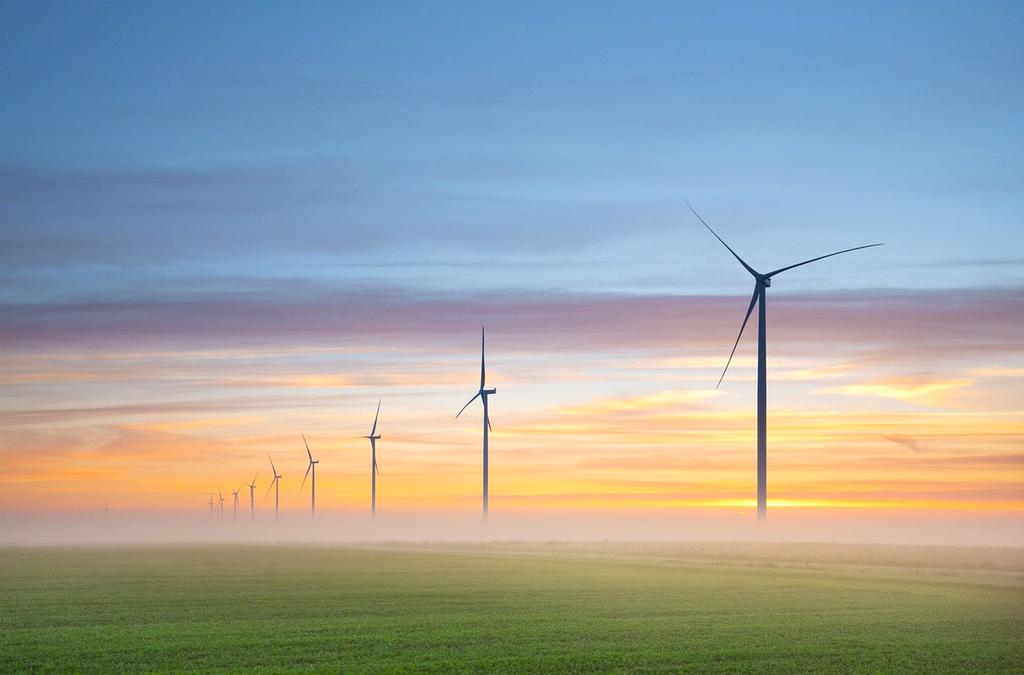 Wind turbines at sunset illustrating renewable energy